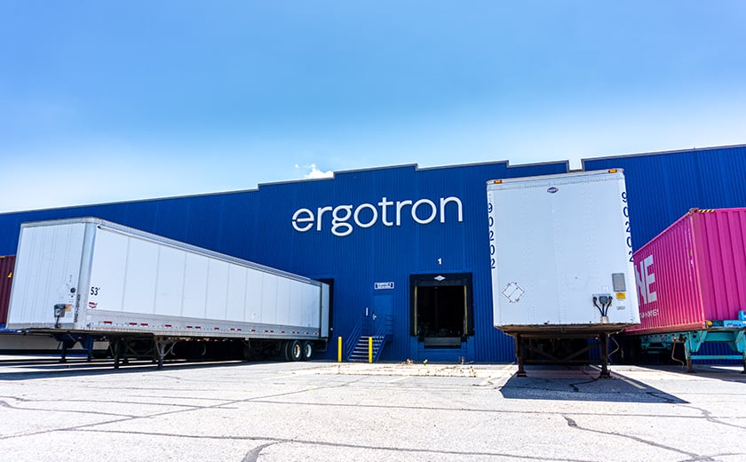 Ergotron exterior signage on building with semi trucks