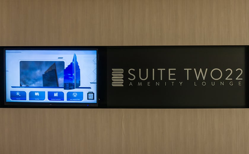 SuiteTwo22 Amenity Lounge interior wall with TV Screen