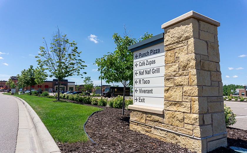 Wayfinding sign in commercial parking lot 