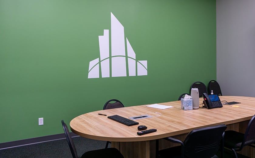 Interior logo display on a green wall 