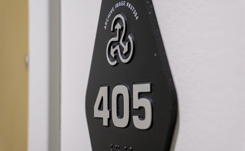 ADA compliant wall sign with braille