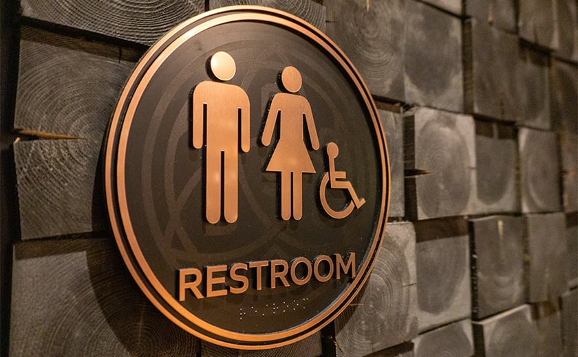 Restroom ADA compliant sign with braille