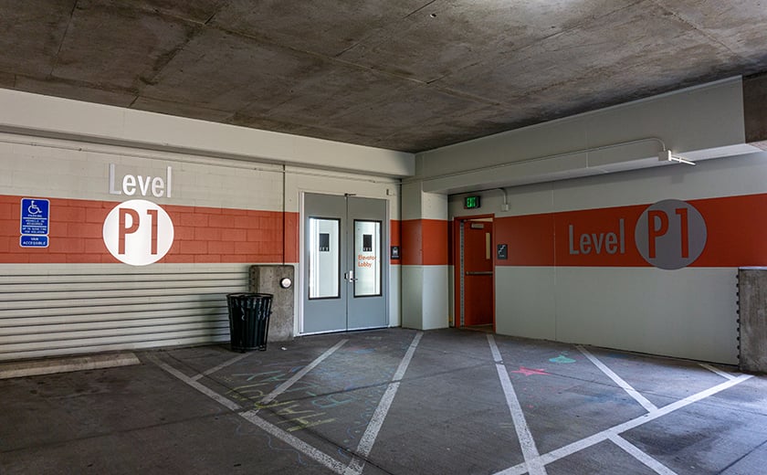 A parking garage level P1 orange signage 