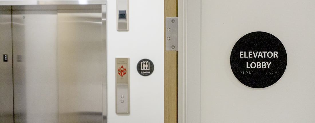 Elevator Lobby signage with braille 