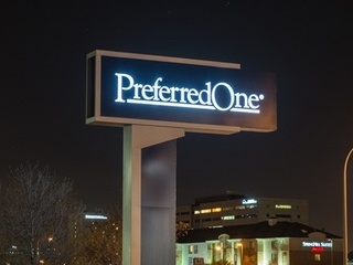Preferred One pylon sign at night